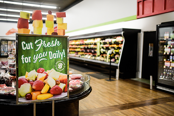 A sign advertising the fresh cut fruit in the newly remodeled Huntsville store