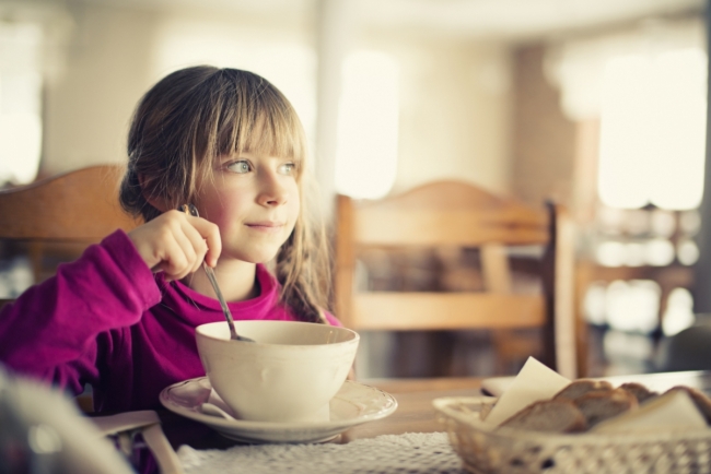 Girl eating soup