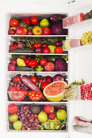 A fridge packed full of fruit.