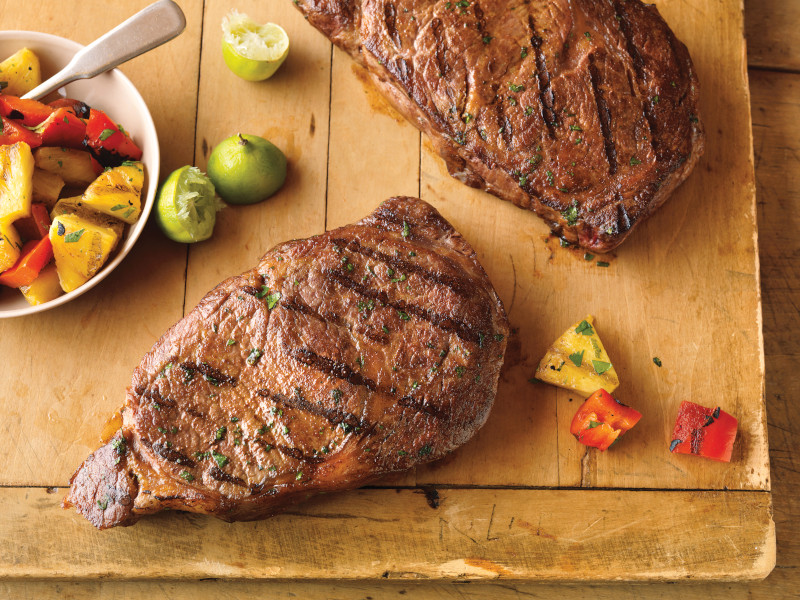 Caribbean Ribeye Steaks with Grilled Pineapple Salad